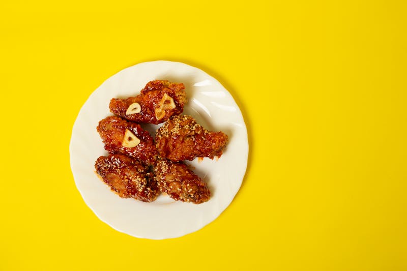 Crispy chicken wings with signature sauce