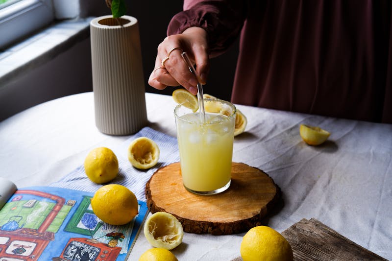 Fresh lemonade in a tall glass with ice